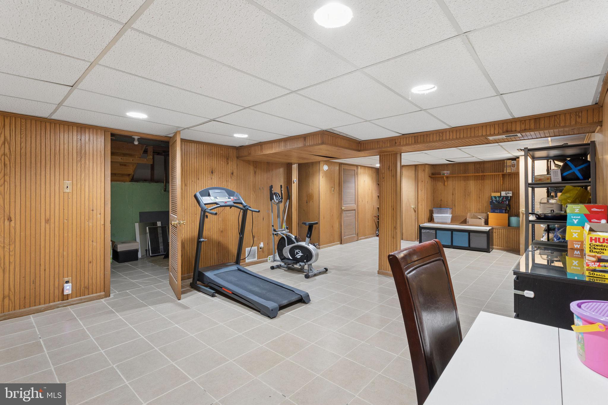 252 Sandringham Road Cherry Hill, NJ 08003 - Photo 25 of 31 a room with gym equipment and a table