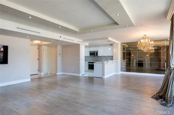a view of large kitchen with stainless steel appliances kitchen island