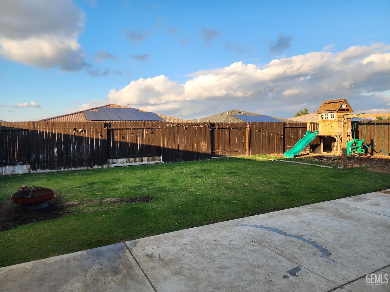 Undisclosed Address Bakersfield, CA 93307 - Photo 11 of 11 a view of a yard with a house