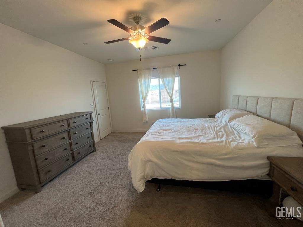 Undisclosed Address Bakersfield, CA 93307 - Photo 9 of 11 a bedroom with a bed dresser and a window