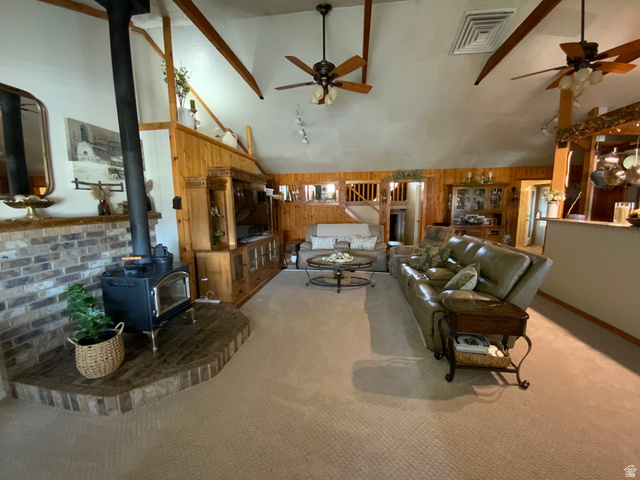 1061 Copper Street Stockton, UT 84071 - Photo 6 of 43 Spacious living room featuring a vaulted ceiling with exposed wood beams
