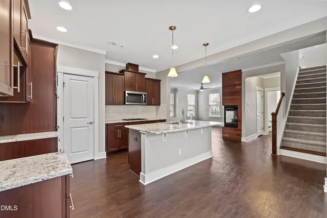 a view of an entryway with wooden floor