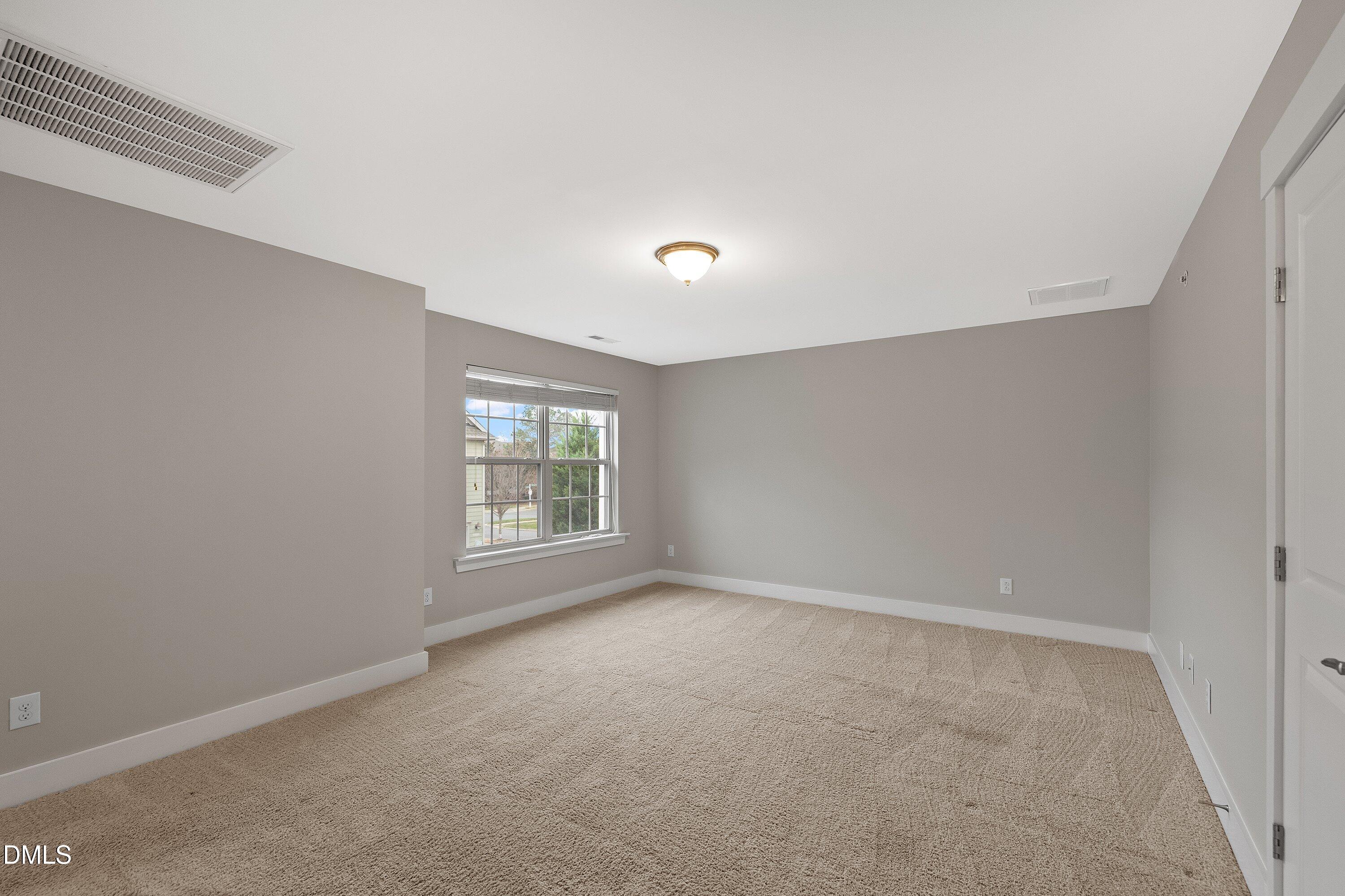 9903 Remedios Walk Raleigh, NC 27617 - Photo 25 of 53 a view of an empty room with a window