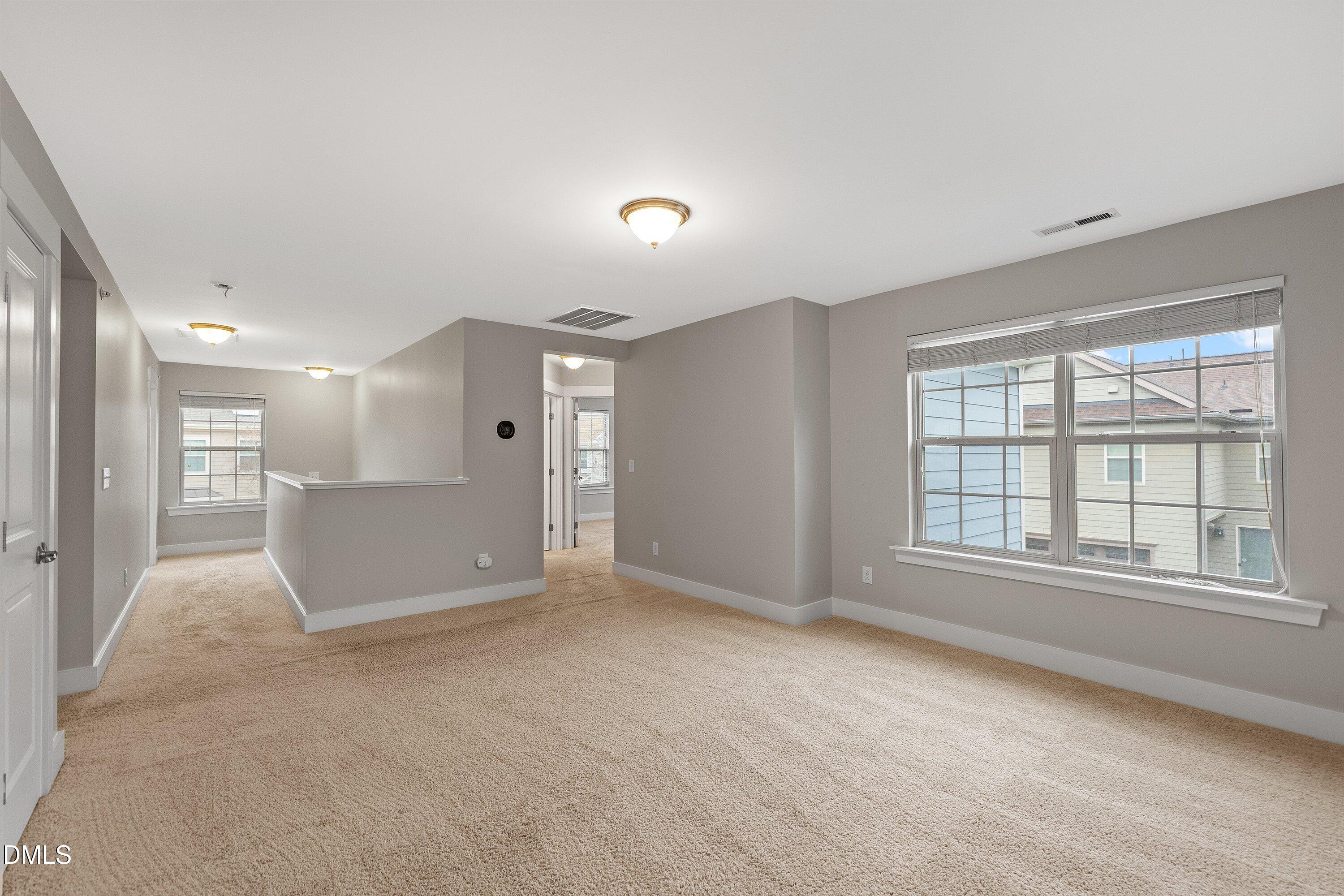 9903 Remedios Walk Raleigh, NC 27617 - Photo 26 of 53 an empty room with windows and entrance
