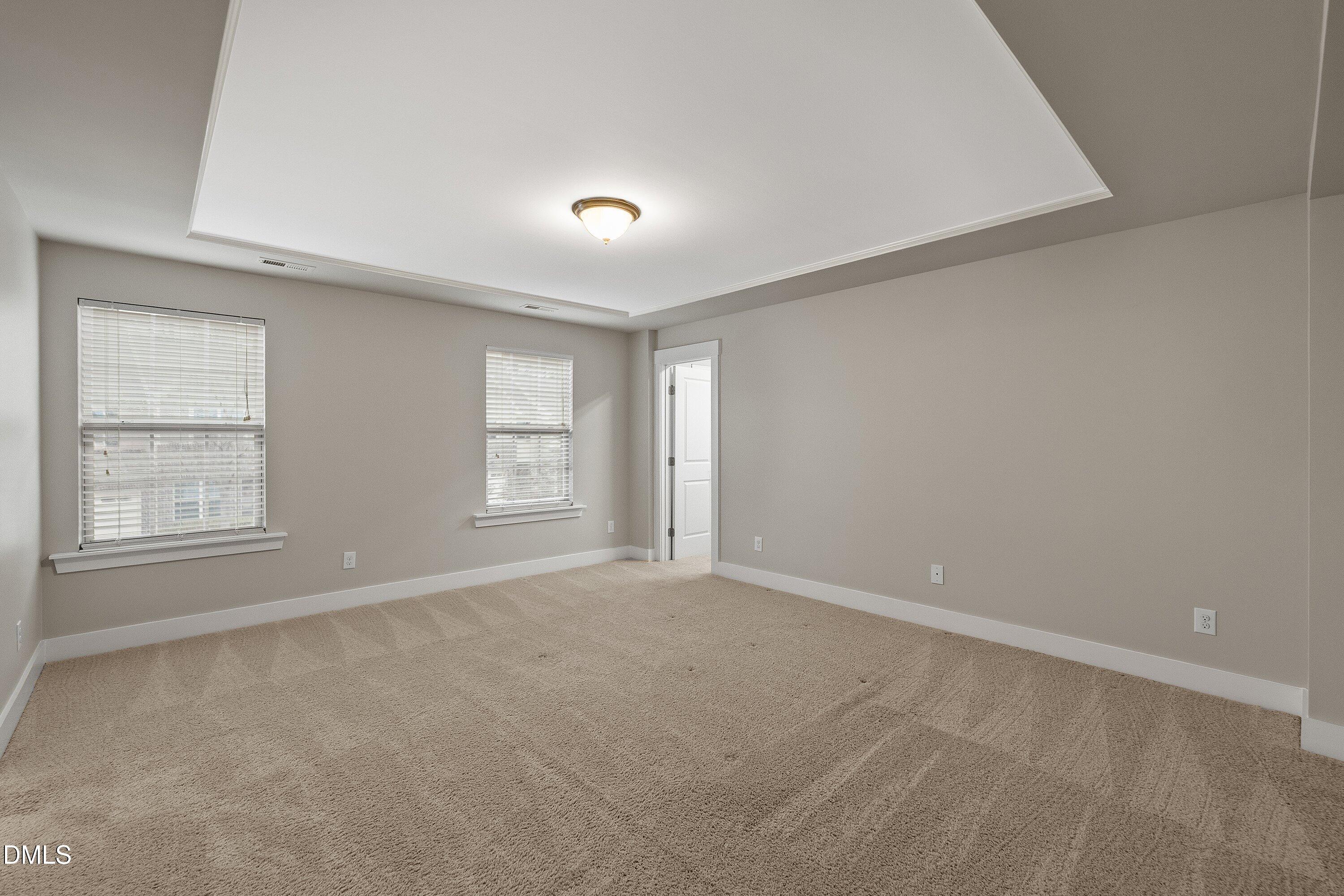 9903 Remedios Walk Raleigh, NC 27617 - Photo 28 of 53 an empty room with windows