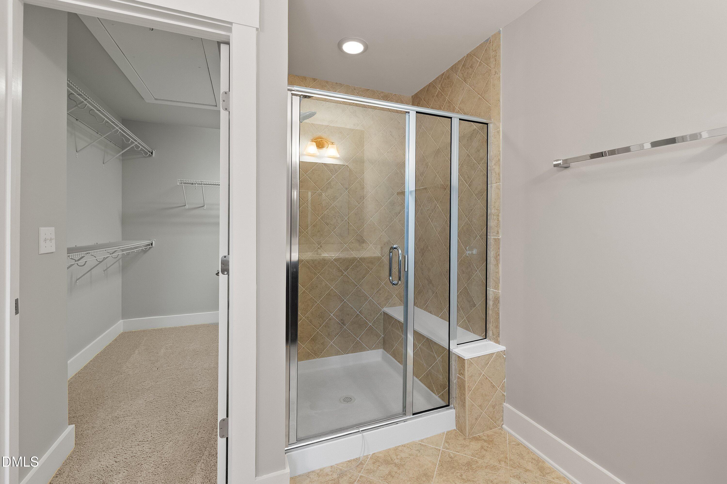 9903 Remedios Walk Raleigh, NC 27617 - Photo 35 of 53 a bathroom with a glass shower door