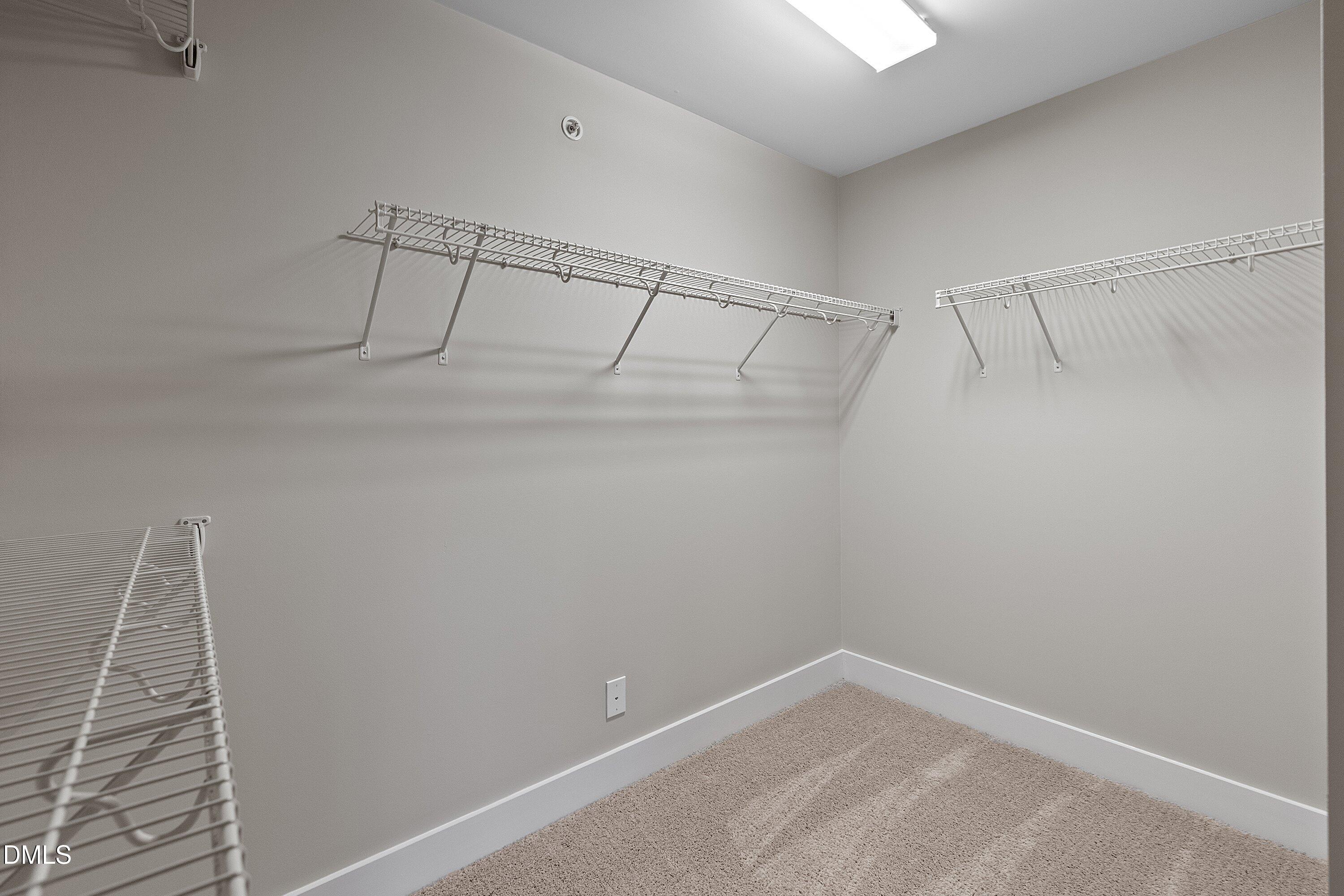 9903 Remedios Walk Raleigh, NC 27617 - Photo 37 of 53 a view of a room with racks on the wall