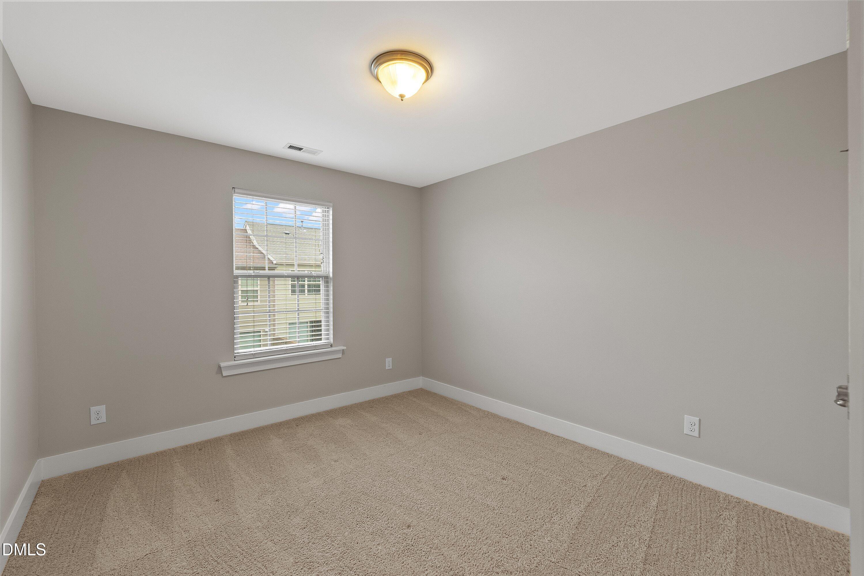 9903 Remedios Walk Raleigh, NC 27617 - Photo 38 of 53 an empty room with a window
