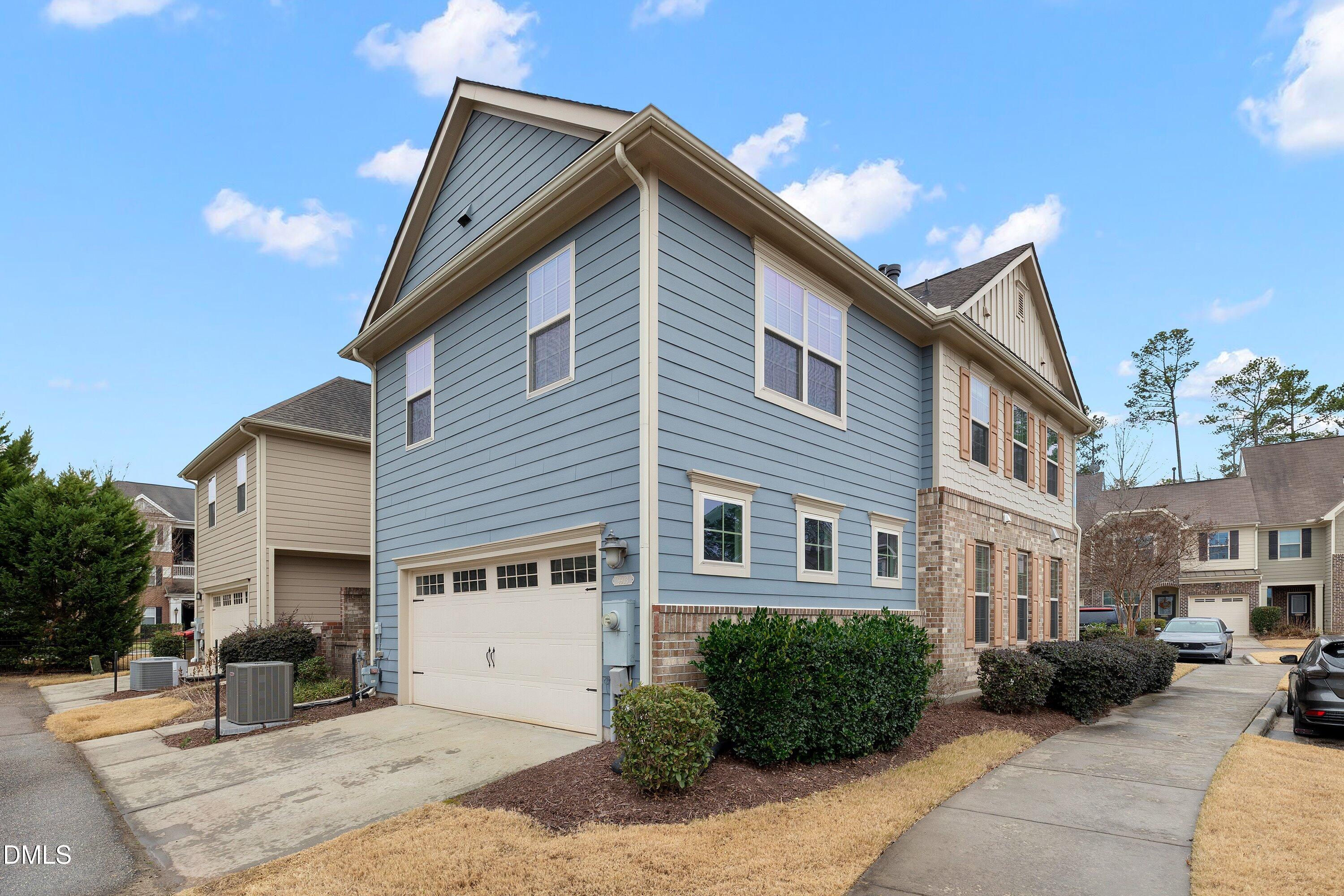 9903 Remedios Walk Raleigh, NC 27617 - Photo 44 of 53 a front view of a house with a yard