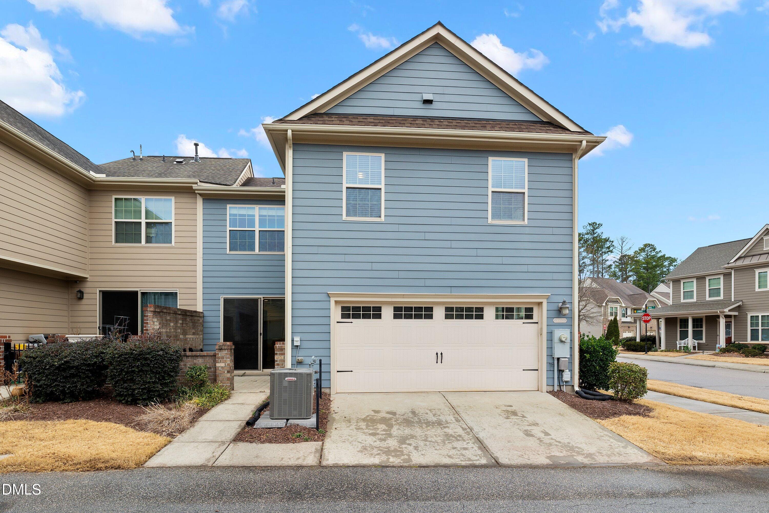 9903 Remedios Walk Raleigh, NC 27617 - Photo 45 of 53 a front view of a house with a yard