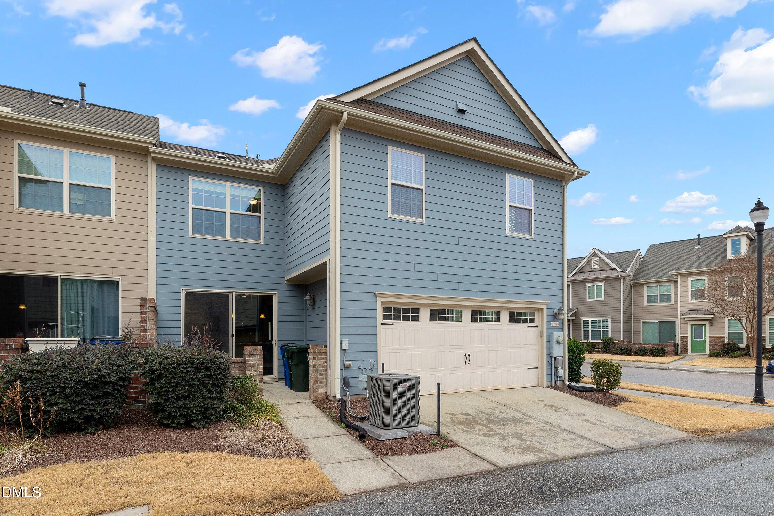 9903 Remedios Walk Raleigh, NC 27617 - Photo 46 of 53 a front view of a house with a yard