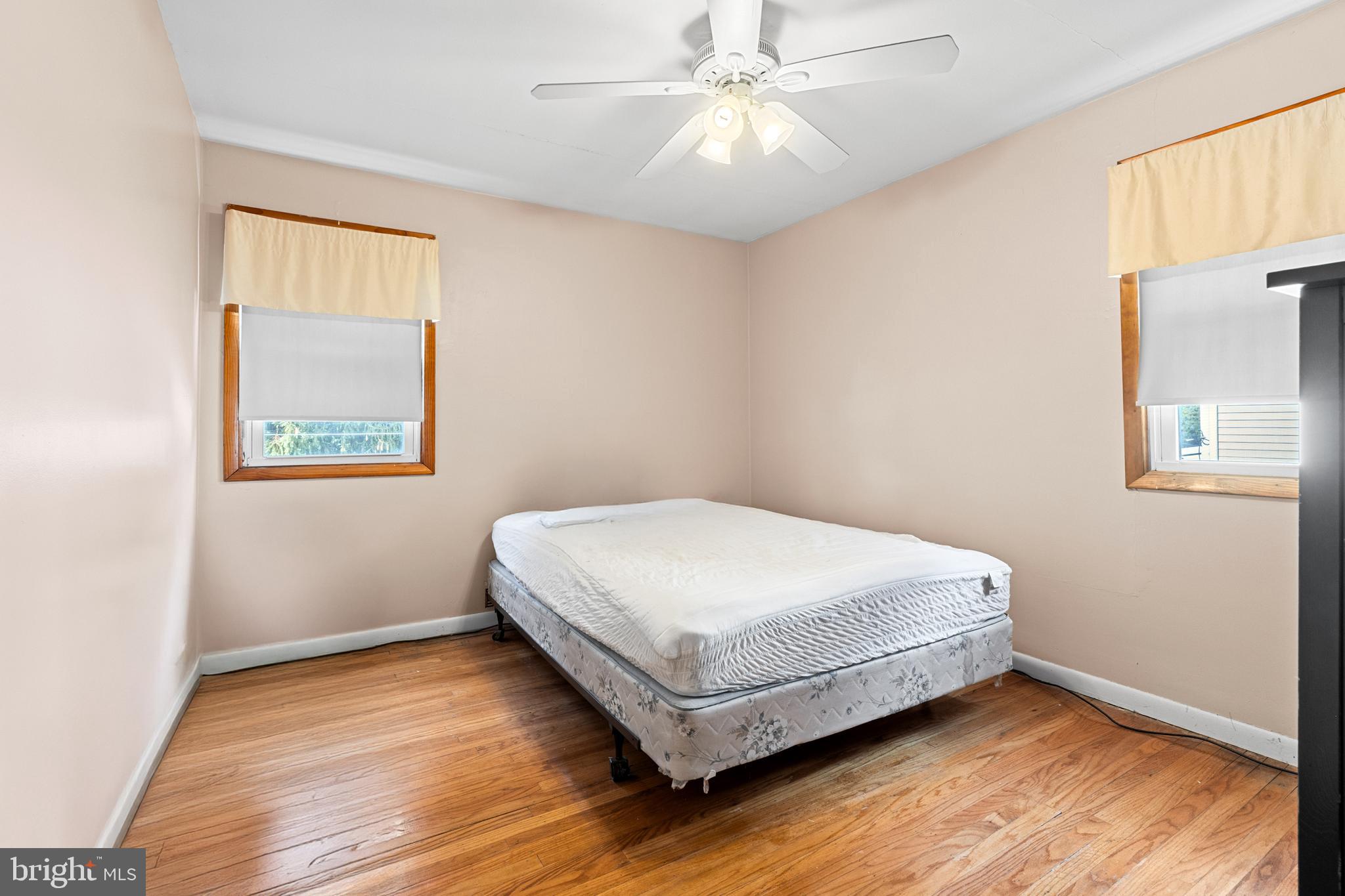 1614 Blackrock Road Swarthmore, PA 19081 - Photo 19 of 31 a bedroom with a bed and window