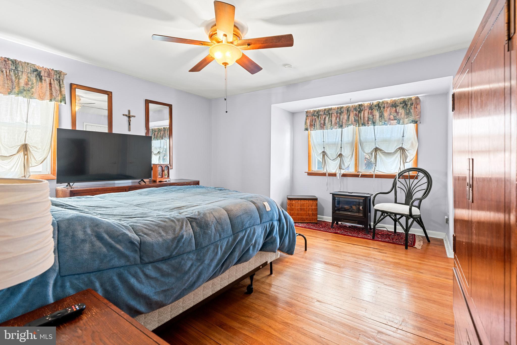 1614 Blackrock Road Swarthmore, PA 19081 - Photo 22 of 31 a bedroom with a bed and a chandelier