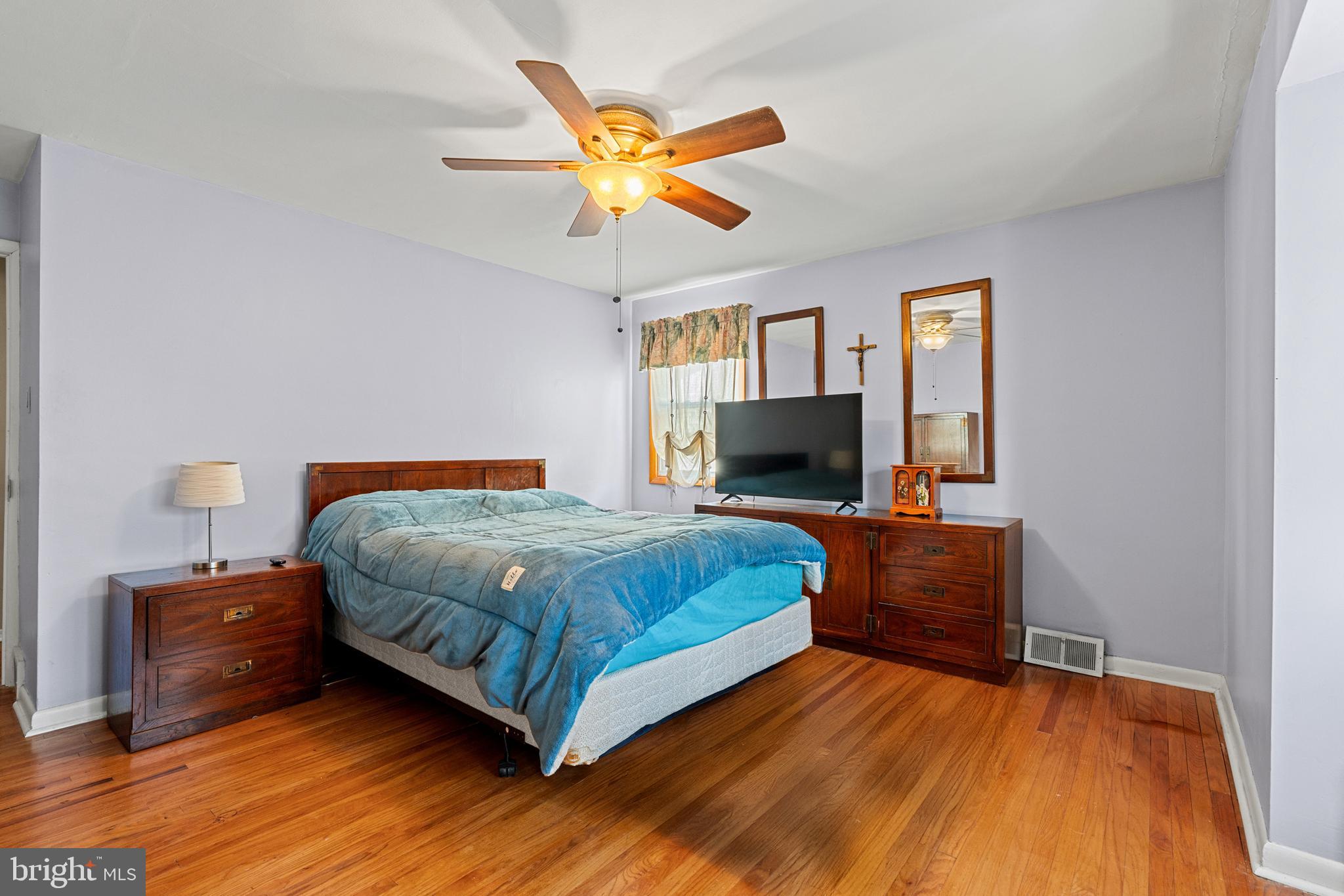 1614 Blackrock Road Swarthmore, PA 19081 - Photo 23 of 31 a bedroom with a bed and a flat screen tv