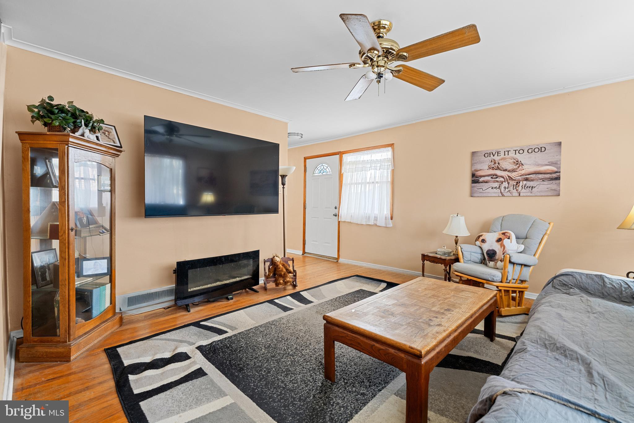 1614 Blackrock Road Swarthmore, PA 19081 - Photo 6 of 31 a living room with furniture a flat screen tv and a fireplace