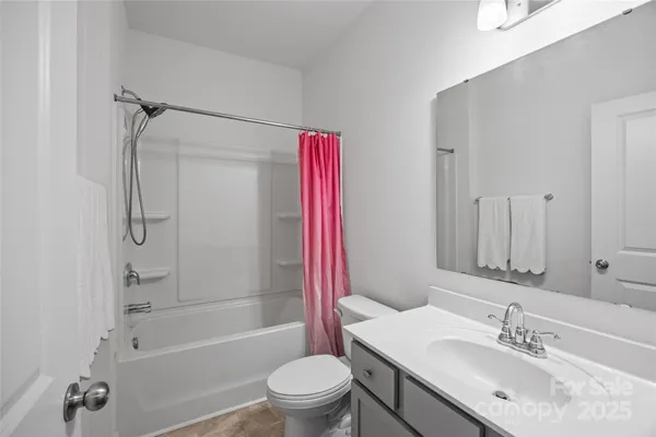 a bathroom with a sink toilet tub and shower