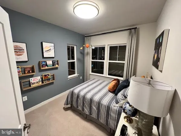 a bedroom with bed and window