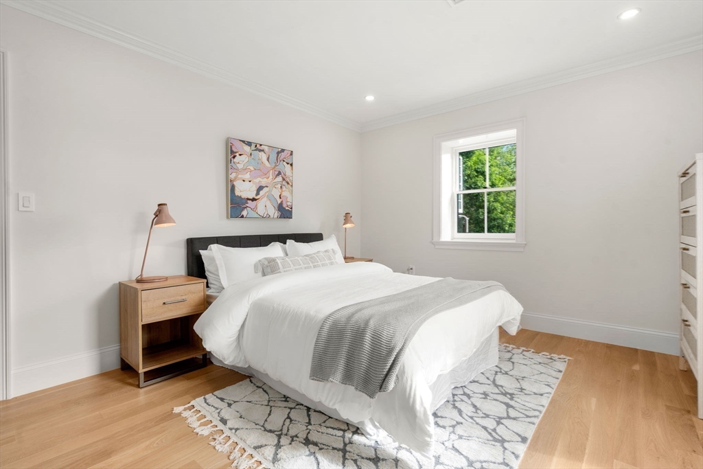 41 Waverly Street Brookline, MA 02445 - Photo 18 of 38 a bedroom with a bed and a window