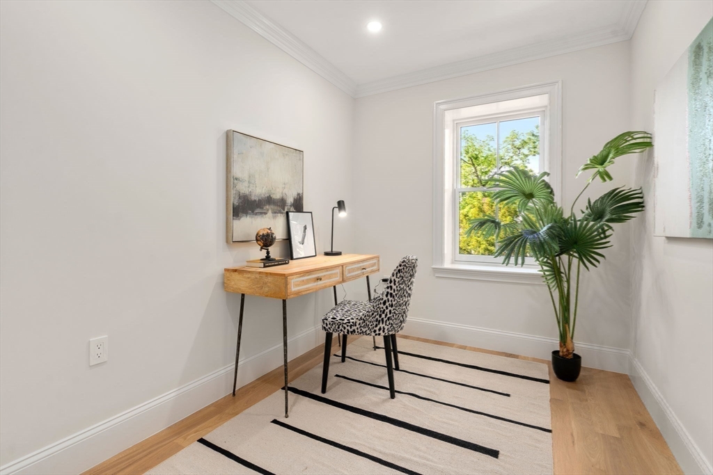 41 Waverly Street Brookline, MA 02445 - Photo 23 of 38 a view of a workspace room with furniture and a potted plant