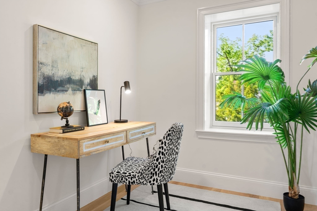 41 Waverly Street Brookline, MA 02445 - Photo 24 of 38 a view of a room with a table and chairs in a room