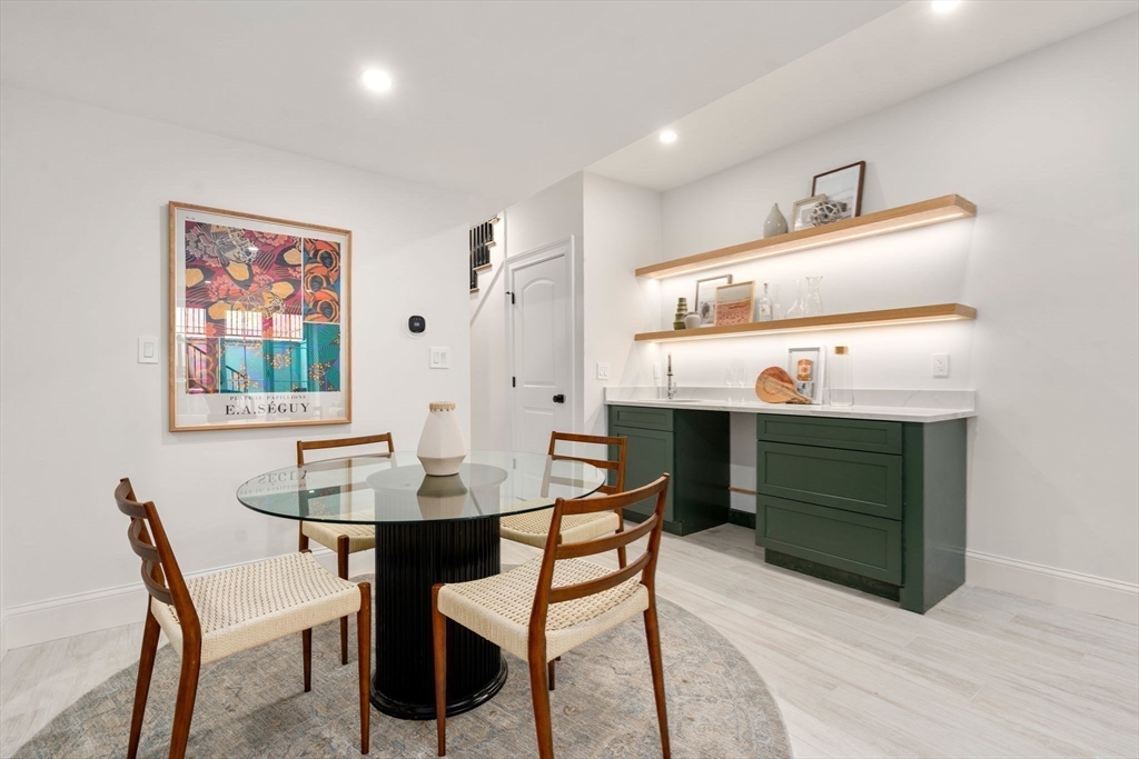 41 Waverly Street Brookline, MA 02445 - Photo 27 of 38 a dining room with a table and chairs