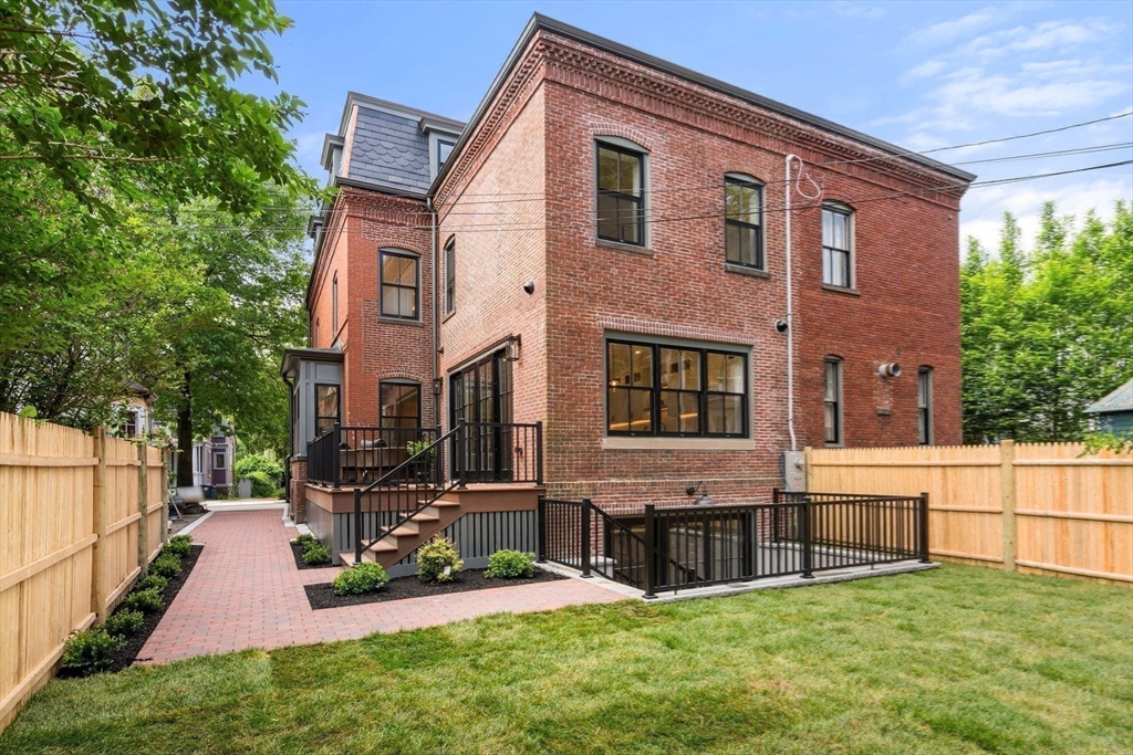 41 Waverly Street Brookline, MA 02445 - Photo 33 of 38 a view of an house with backyard and a tree