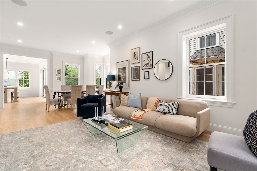 41 Waverly Street Brookline, MA 02445 - Photo 6 of 38 a living room with furniture a fireplace and a table
