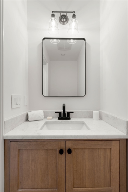 41 Waverly Street Brookline, MA 02445 - Photo 10 of 38 a bathroom with a sink vanity and a mirror