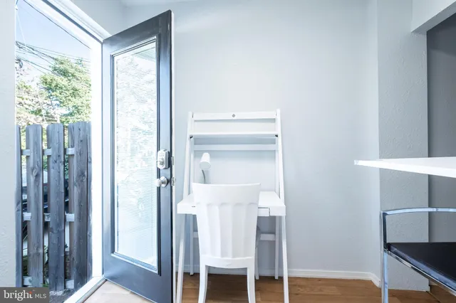 a bathroom with a mirror and a shower