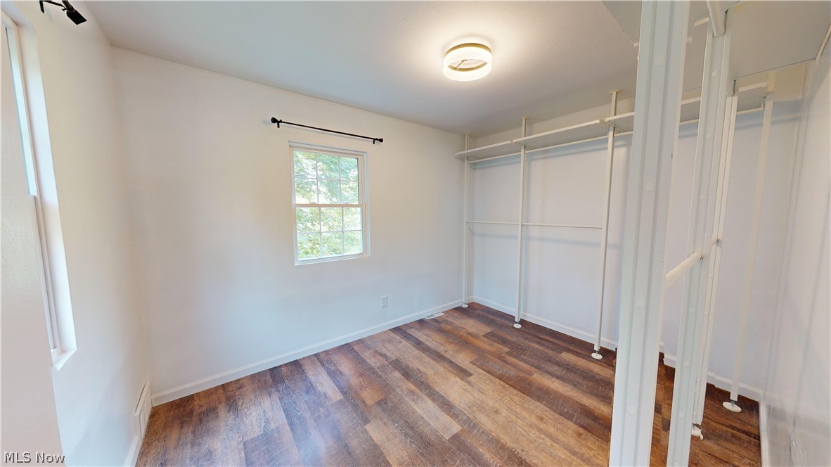 3075 Ludlow Road Cleveland, OH 44120 - Photo 18 of 30 Master Bedroom walk in closet with wood-style flooring