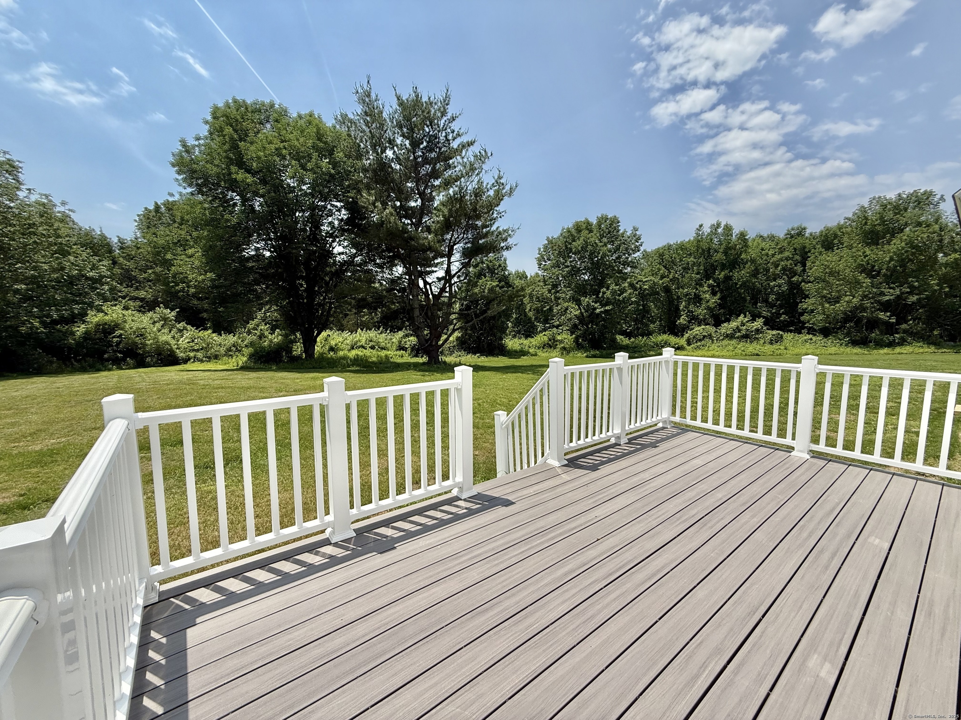 249 Wall Street Hebron, CT 06248 - Photo 5 of 28 a balcony with wooden floor and fence