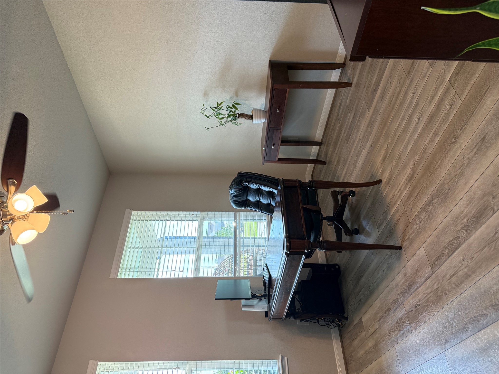 2336 Hagerman Road Conroe, TX 77384 - Photo 8 of 35 a living room with furniture and a wooden floor