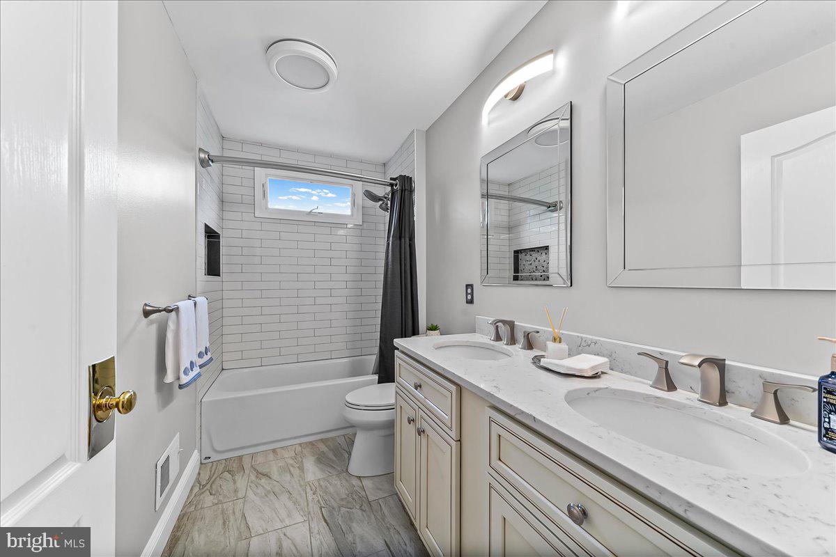 408 Brentford Road Kennett Square, PA 19348 - Photo 29 of 41 a bathroom with a granite countertop sink toilet and shower