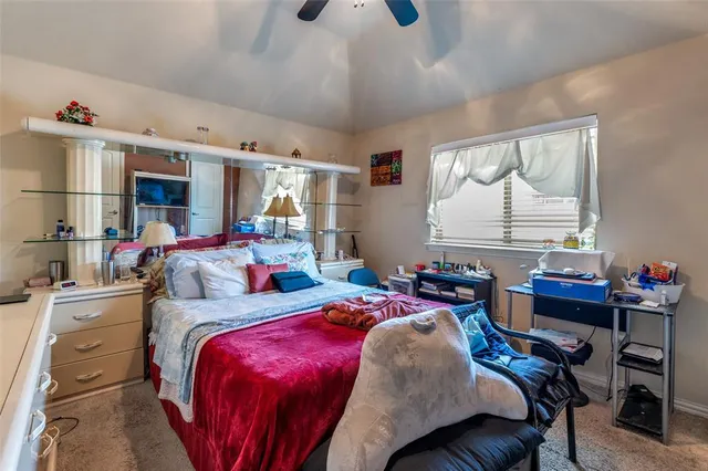 a bedroom with a bed and a table