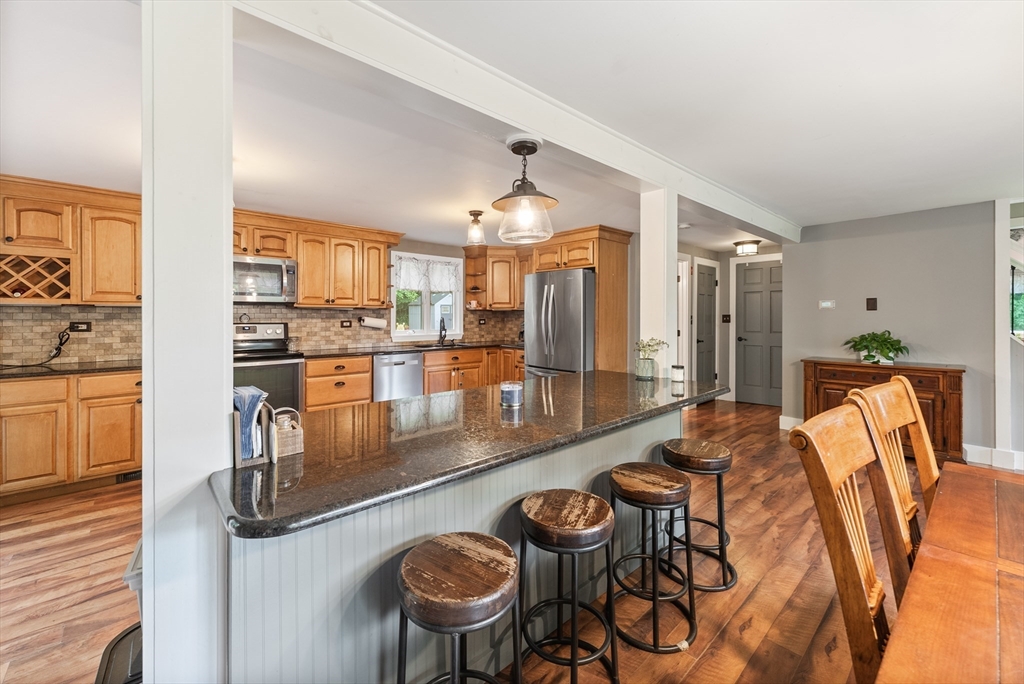 95 Ely Road Monson, MA 01057 - Photo 11 of 42 a large kitchen with a table and chairs