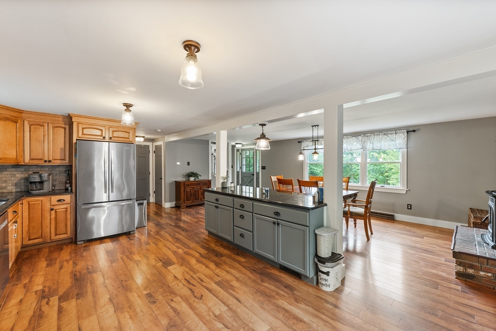 95 Ely Road Monson, MA 01057 - Photo 14 of 42 a kitchen with stainless steel appliances wooden floor and refrigerator