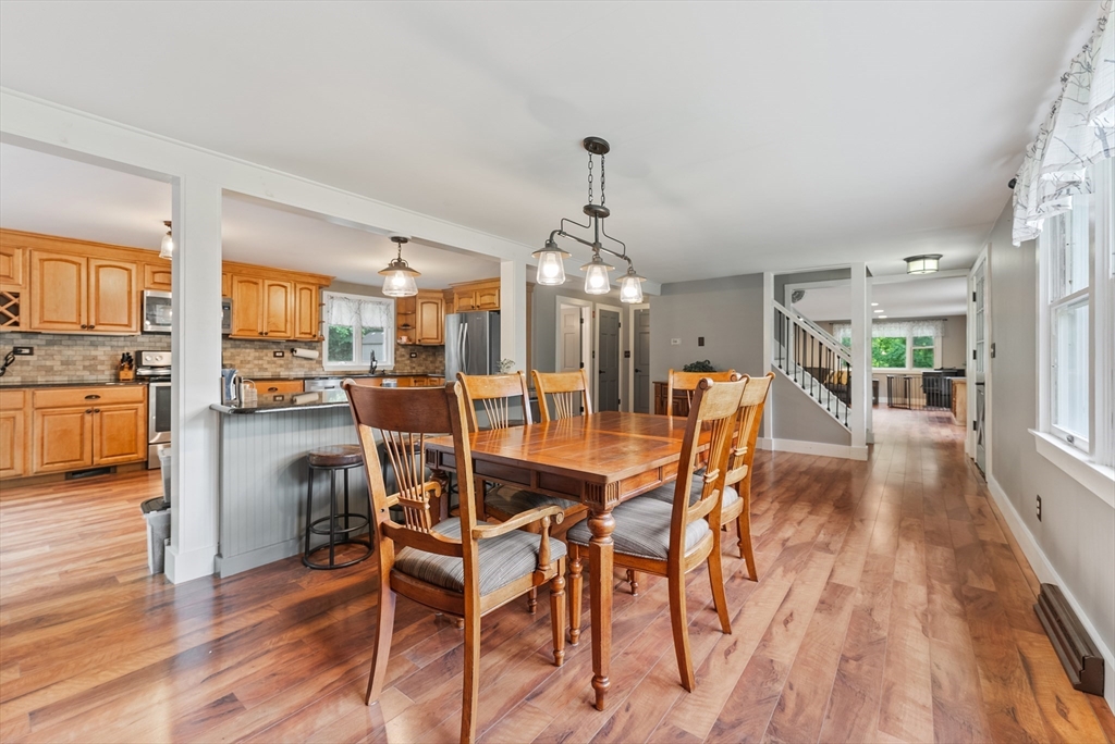 95 Ely Road Monson, MA 01057 - Photo 18 of 42 a dining room with furniture a chandelier and wooden floor