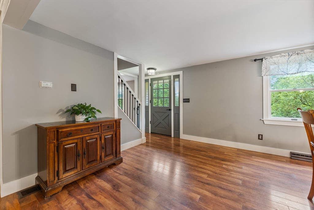 95 Ely Road Monson, MA 01057 - Photo 19 of 42 a view of an empty room with wooden floor and a window