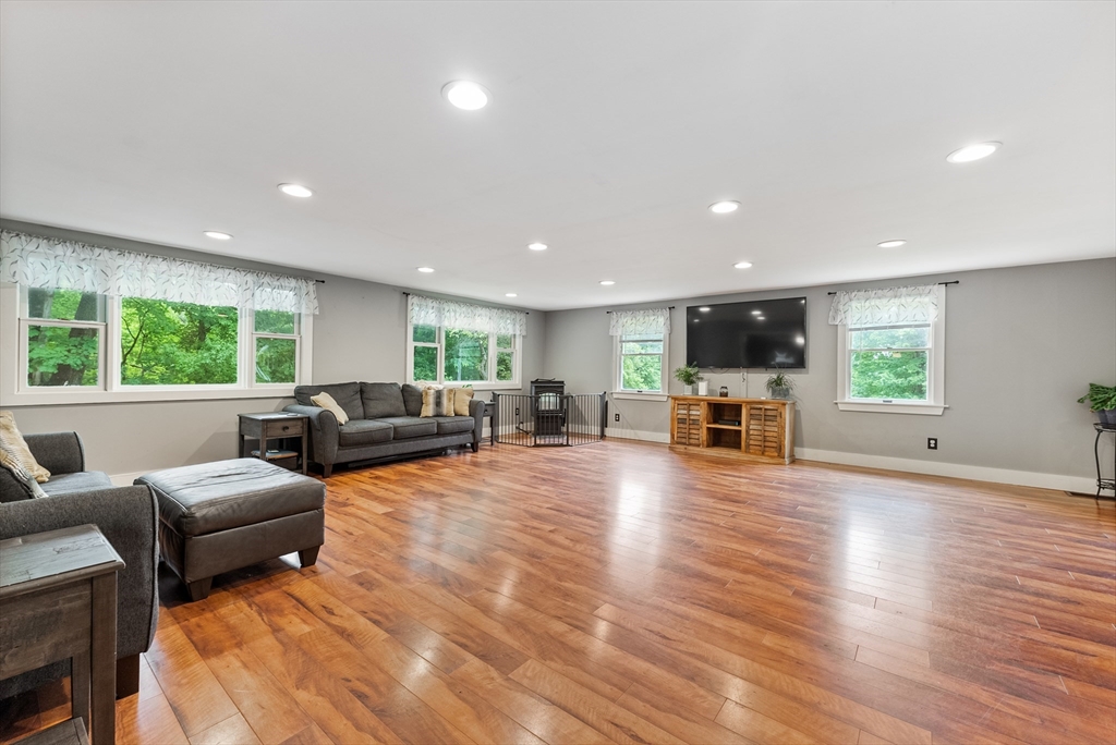 95 Ely Road Monson, MA 01057 - Photo 21 of 42 a living room with furniture and a wooden floor