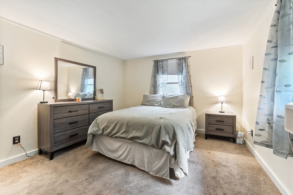 95 Ely Road Monson, MA 01057 - Photo 29 of 42 a bedroom with a bed and a night stand