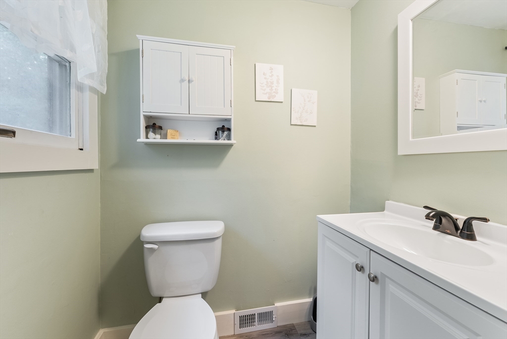 95 Ely Road Monson, MA 01057 - Photo 31 of 42 a bathroom with a toilet sink and mirror