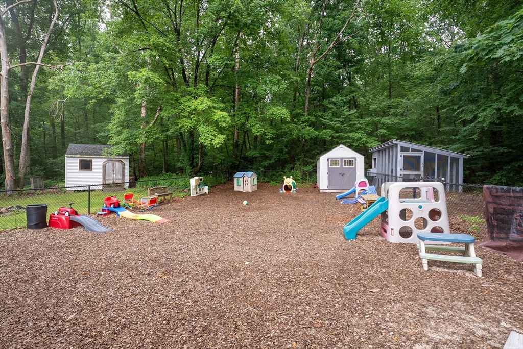 95 Ely Road Monson, MA 01057 - Photo 7 of 42 a small garden covered with tall trees