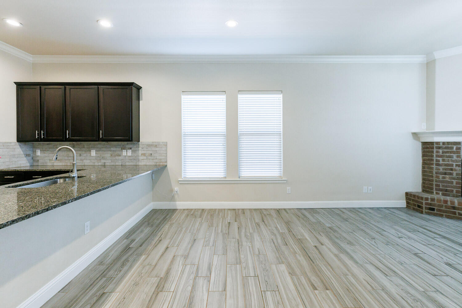 13801 Uvalde Avenue Lubbock, TX 79423 - Photo 14 of 46 a view of a kitchen with a sink and microwave