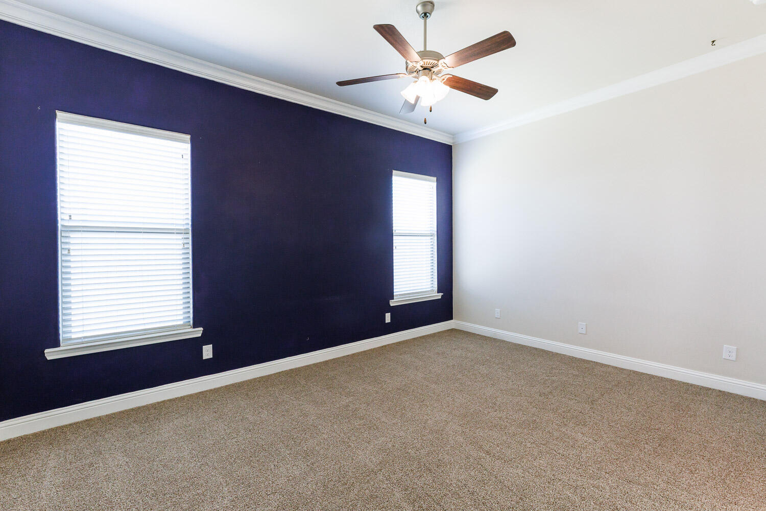 13801 Uvalde Avenue Lubbock, TX 79423 - Photo 21 of 46 an empty room with a window and a ceiling fan