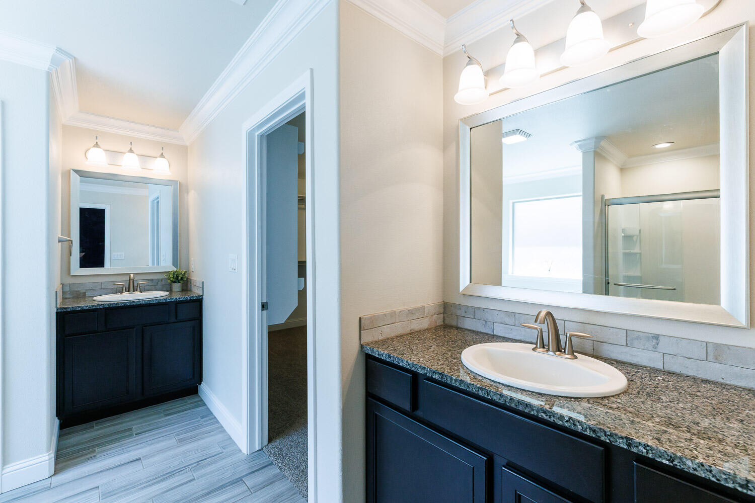 13801 Uvalde Avenue Lubbock, TX 79423 - Photo 26 of 46 a bathroom with a granite countertop sink and a mirror