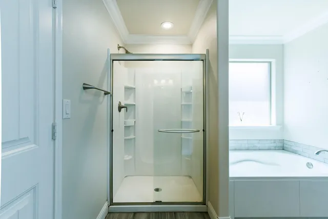a bathroom with a bathtub and a shower