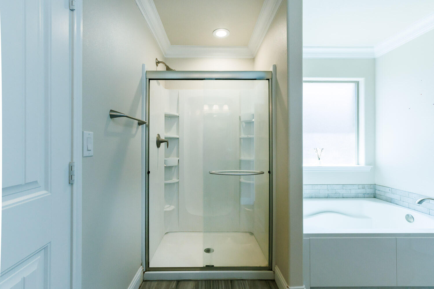 13801 Uvalde Avenue Lubbock, TX 79423 - Photo 30 of 46 a bathroom with a bathtub and a shower