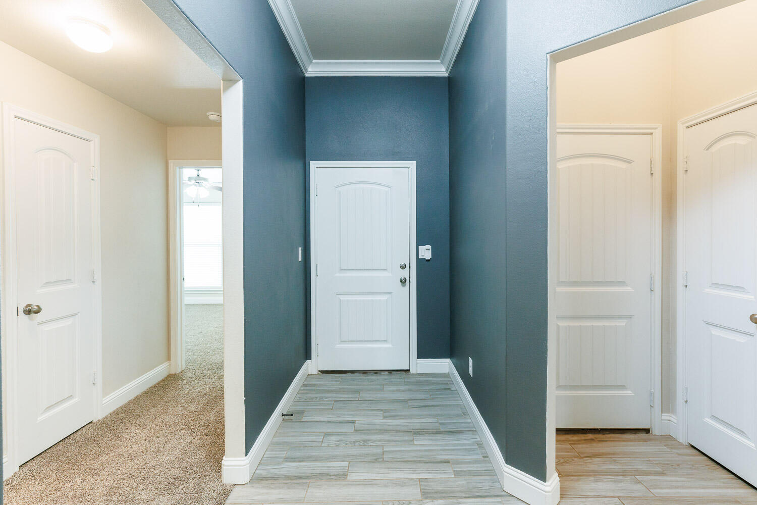 13801 Uvalde Avenue Lubbock, TX 79423 - Photo 3 of 46 a view of a hallway with wooden floor and closet