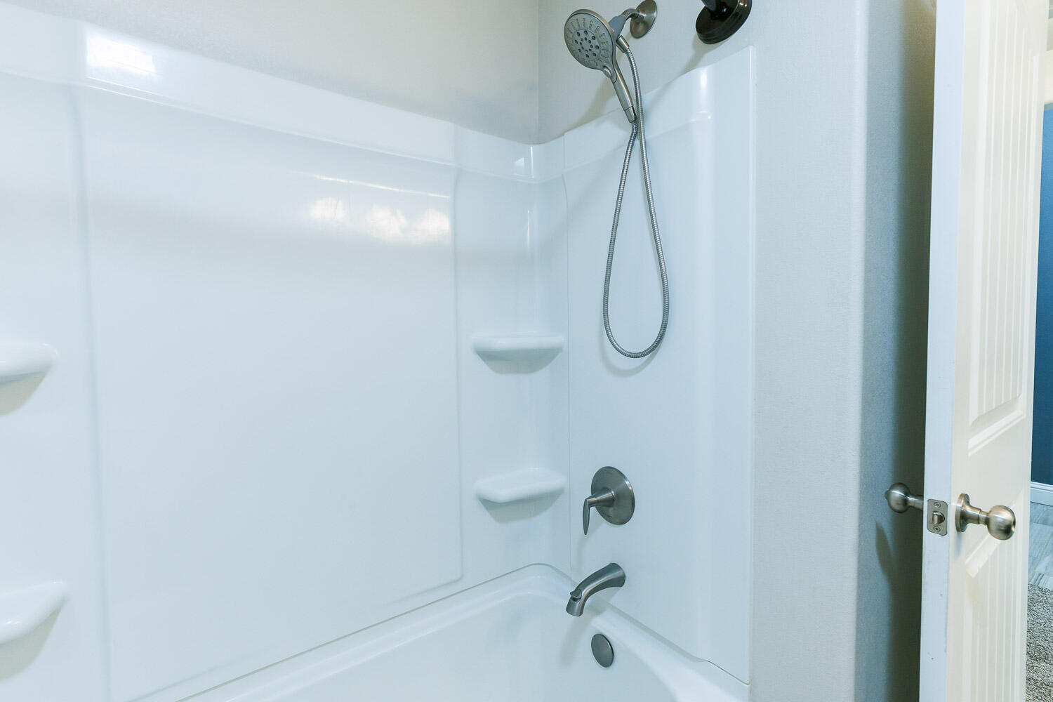 13801 Uvalde Avenue Lubbock, TX 79423 - Photo 38 of 46 a bathroom with a bath tub with a shower