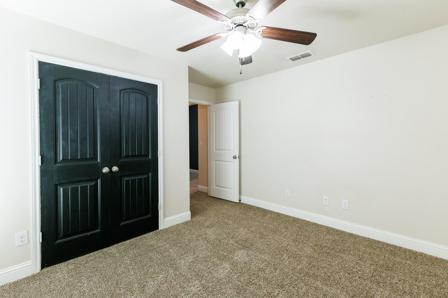 13801 Uvalde Avenue Lubbock, TX 79423 - Photo 41 of 46 an empty room with closet and a chandelier fan